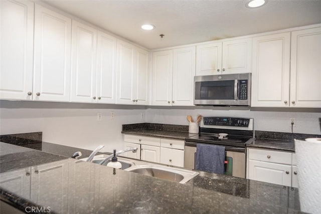 kitchen featuring white cabinets, sink, and stainless steel appliances