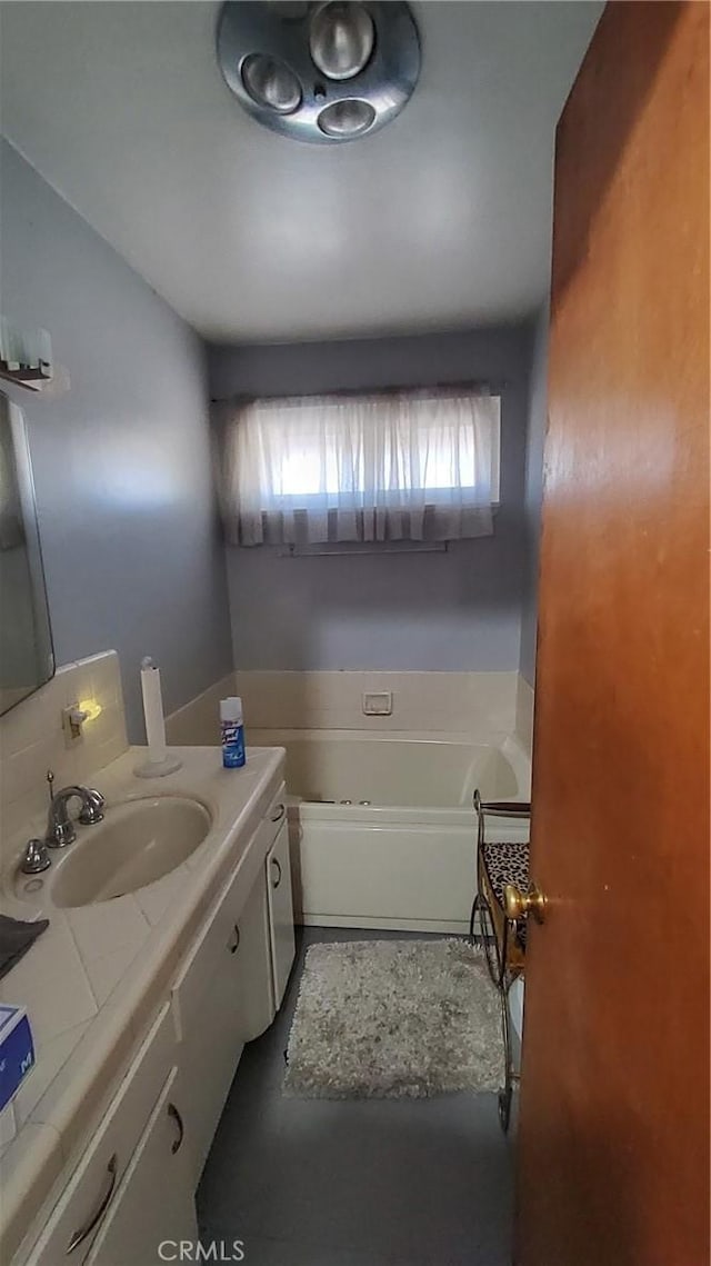 bathroom featuring vanity and a bathtub