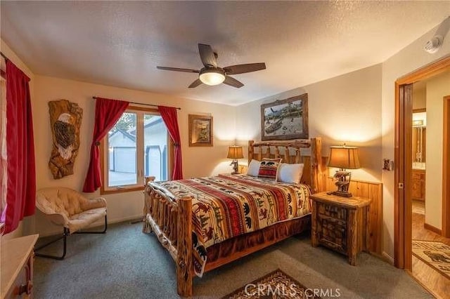 bedroom featuring a textured ceiling, ceiling fan, and carpet floors