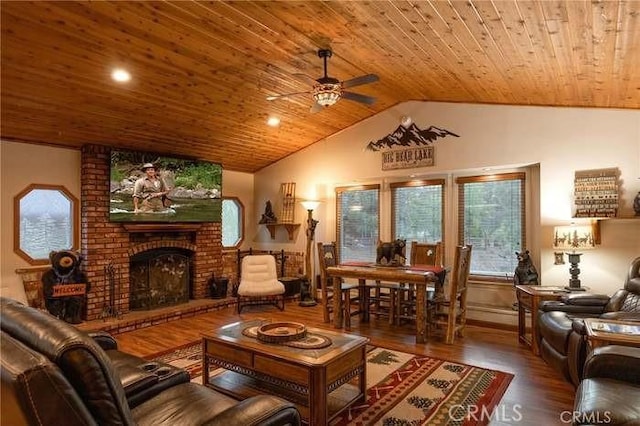 living room with wood ceiling, wood-type flooring, a fireplace, vaulted ceiling, and ceiling fan