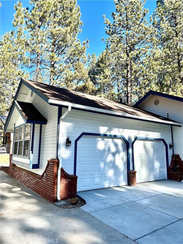 view of side of property with a garage