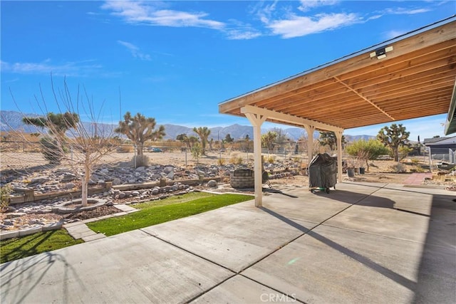 view of patio featuring a grill and a mountain view