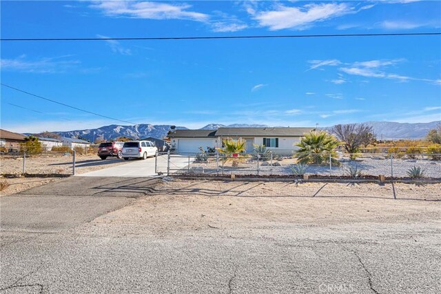 view of front of house featuring a mountain view and a garage