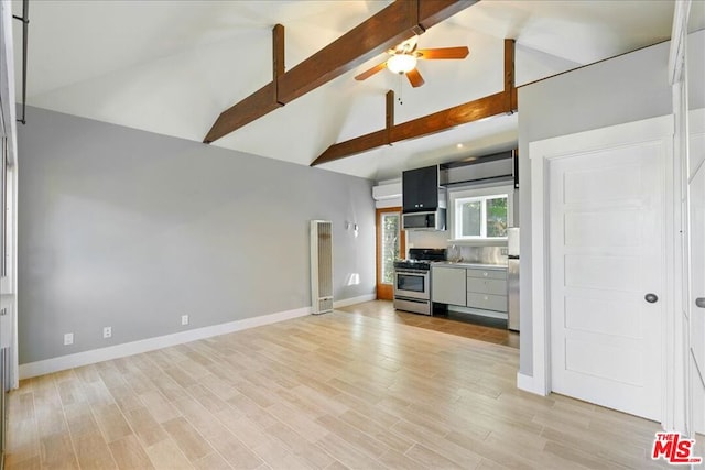 unfurnished living room featuring ceiling fan, light hardwood / wood-style flooring, and vaulted ceiling with beams