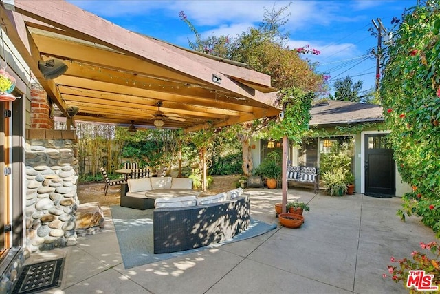 view of patio / terrace featuring ceiling fan and outdoor lounge area