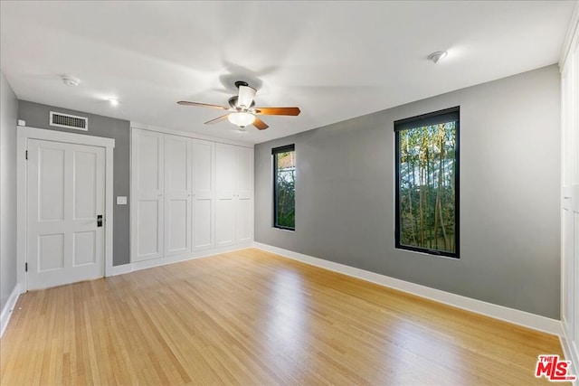 unfurnished room with ceiling fan and light hardwood / wood-style flooring