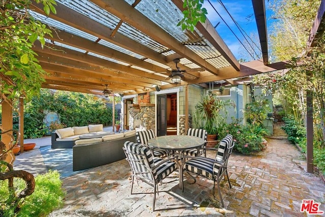 view of patio with ceiling fan, an outdoor hangout area, and a pergola