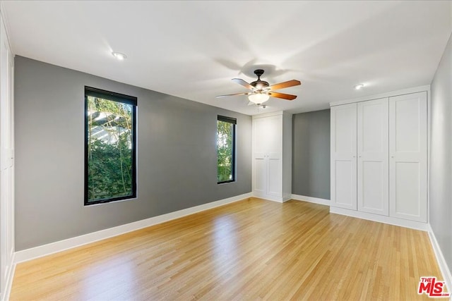 unfurnished bedroom featuring ceiling fan and light hardwood / wood-style floors