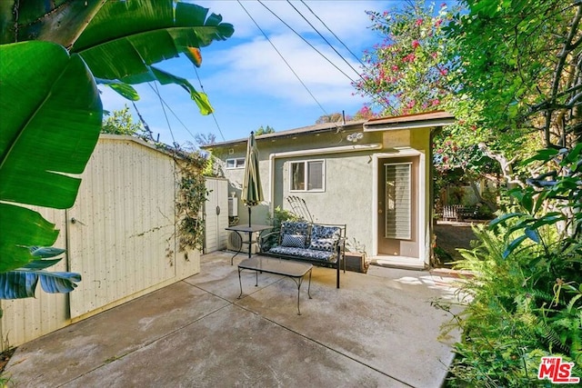 rear view of house with a patio area