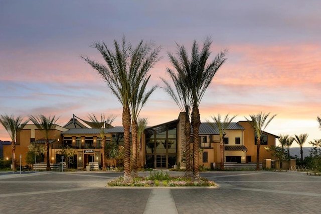 view of outdoor building at dusk