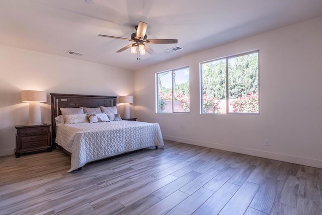 bedroom featuring ceiling fan and light hardwood / wood-style flooring