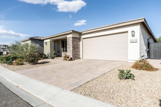 ranch-style home featuring a garage