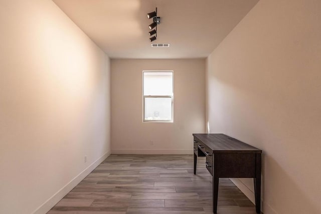 spare room with wood-type flooring