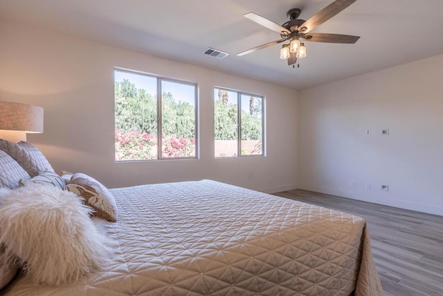 bedroom featuring ceiling fan and hardwood / wood-style floors