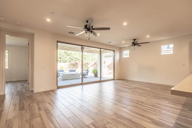 spare room featuring ceiling fan and light wood-type flooring