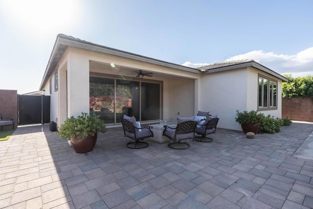 view of patio / terrace featuring ceiling fan