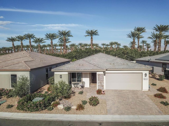 single story home featuring a garage