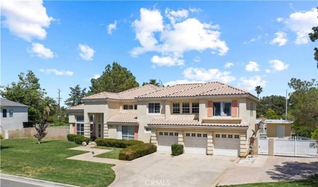 mediterranean / spanish-style home with a front yard and a garage