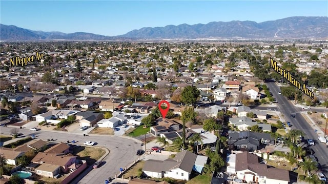 birds eye view of property featuring a mountain view