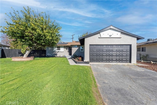 ranch-style house with a front lawn, solar panels, and a garage