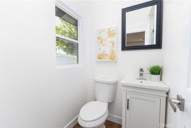 bathroom featuring toilet and vanity