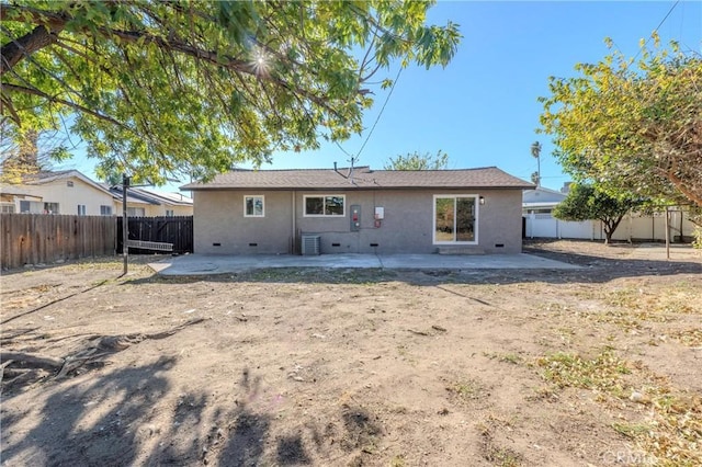 rear view of property featuring a patio area and central air condition unit