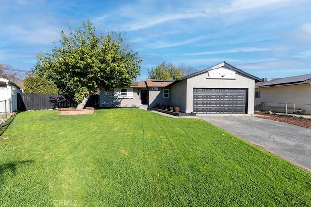 ranch-style home featuring a front lawn and a garage