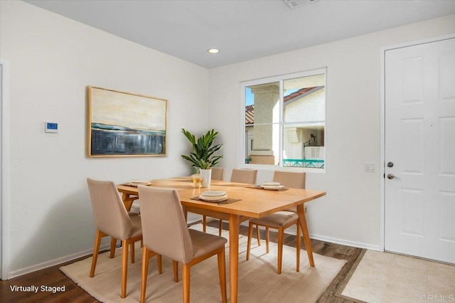 dining area with hardwood / wood-style floors