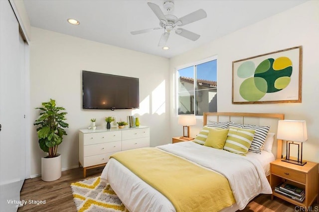 bedroom with baseboards, wood finished floors, a ceiling fan, and recessed lighting