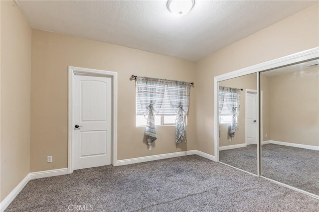 unfurnished bedroom featuring a closet and carpet flooring