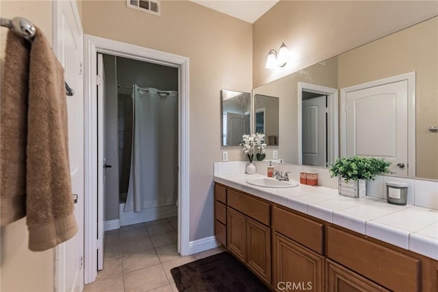 bathroom featuring vanity and tile patterned floors