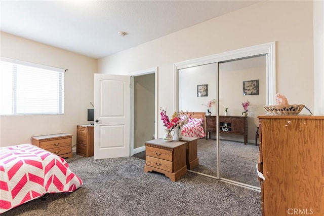 carpeted bedroom featuring a closet