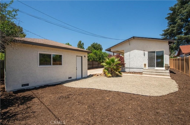 rear view of property featuring a patio