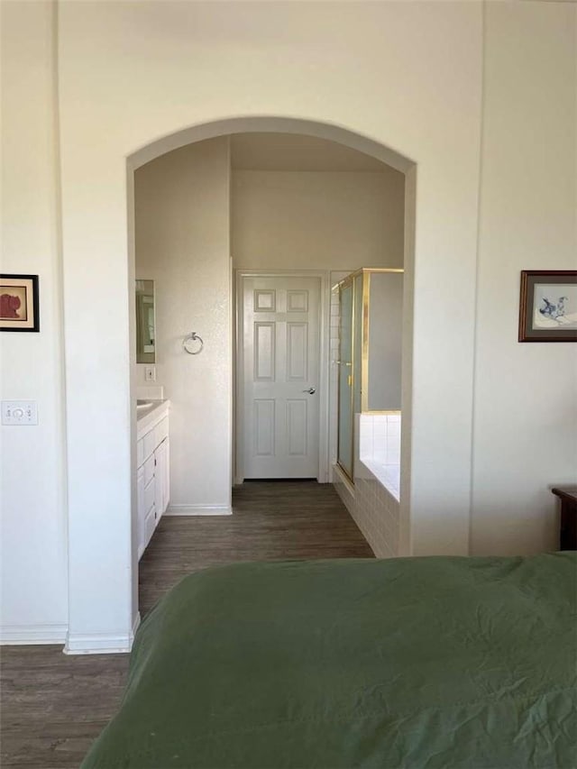 hallway with dark hardwood / wood-style flooring