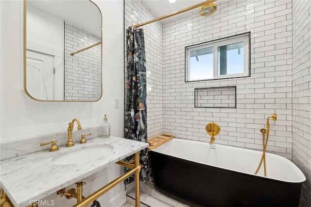 bathroom with shower / tub combo with curtain and sink