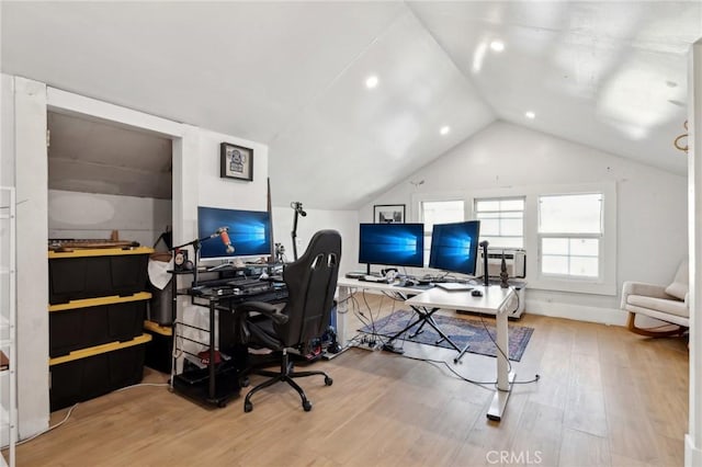 office space with hardwood / wood-style floors and lofted ceiling