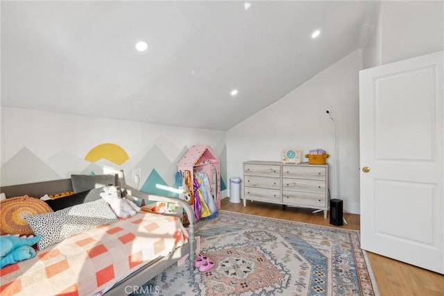 bedroom featuring dark wood-type flooring and vaulted ceiling