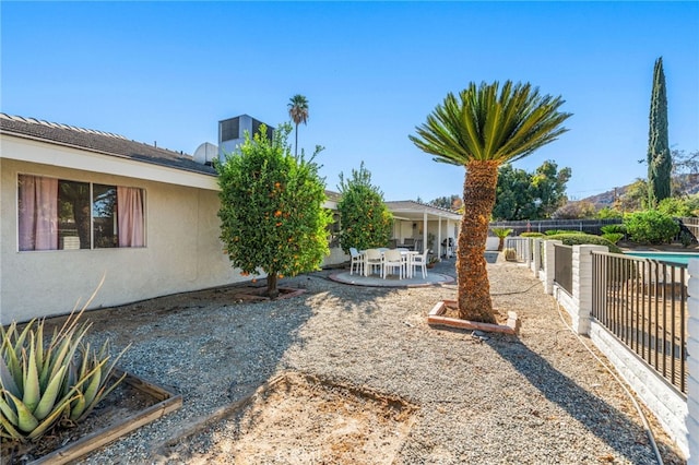 view of yard featuring a patio area and fence