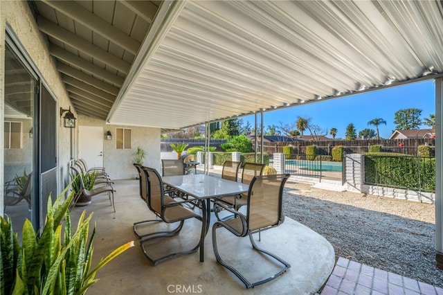 view of patio / terrace featuring a fenced in pool, outdoor dining area, and a fenced backyard