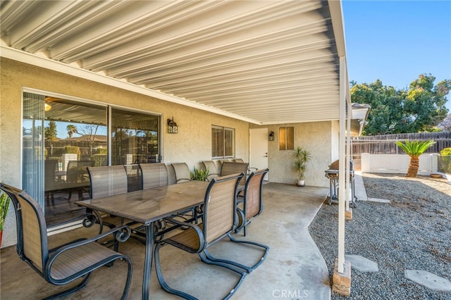 view of patio / terrace featuring outdoor dining space and fence