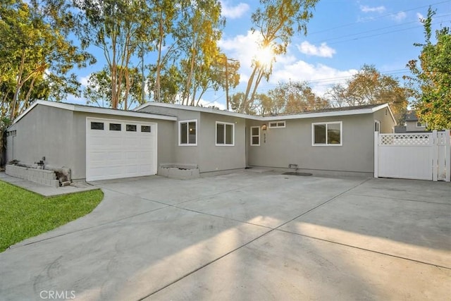 ranch-style house featuring a garage