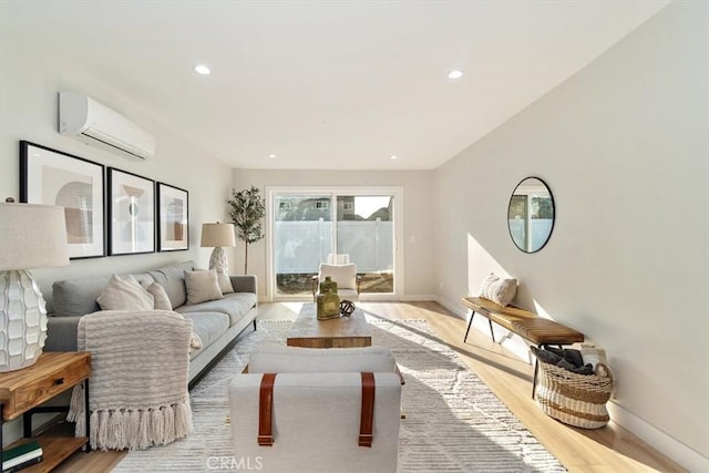 living room with light wood-type flooring and a wall unit AC