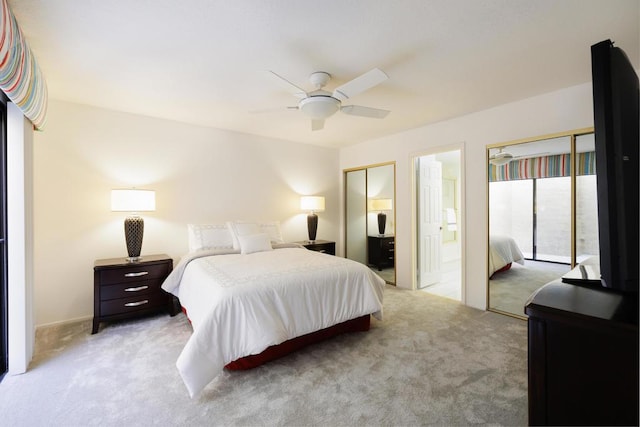 bedroom with ceiling fan, ensuite bathroom, and light carpet