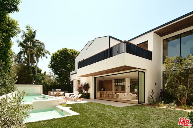 rear view of property with a jacuzzi, a patio, and a yard