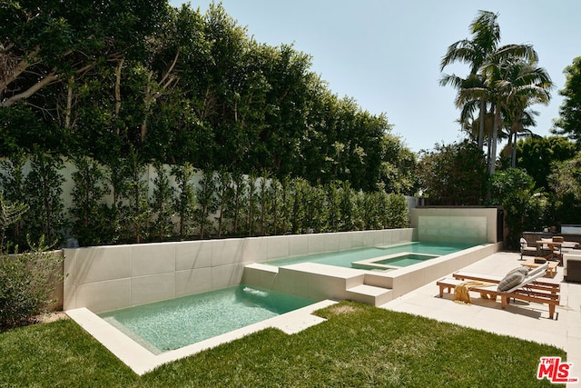 view of pool featuring an in ground hot tub and a patio