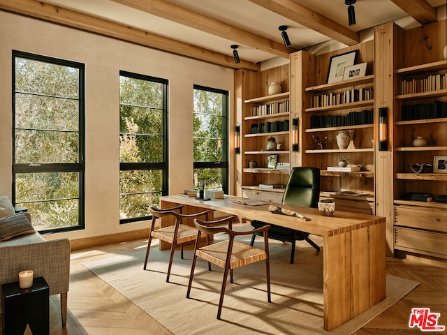 office space featuring light parquet floors and beam ceiling