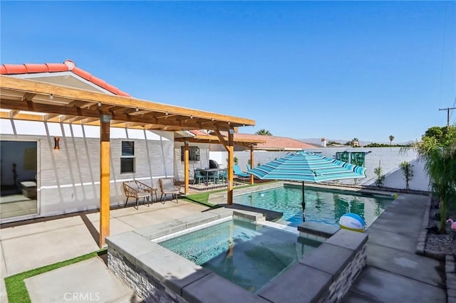 view of swimming pool featuring an in ground hot tub and a patio