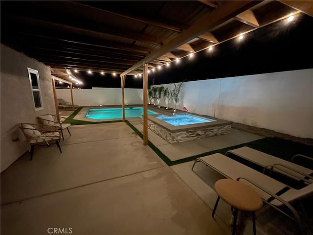 view of pool with an in ground hot tub and a patio area