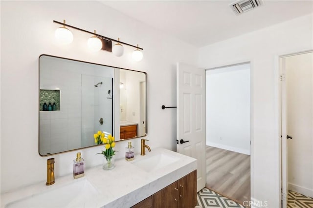 bathroom with vanity and walk in shower