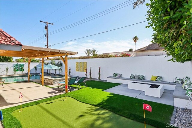 exterior space featuring an outdoor hot tub, an outdoor fire pit, a fenced backyard, a patio, and a fenced in pool